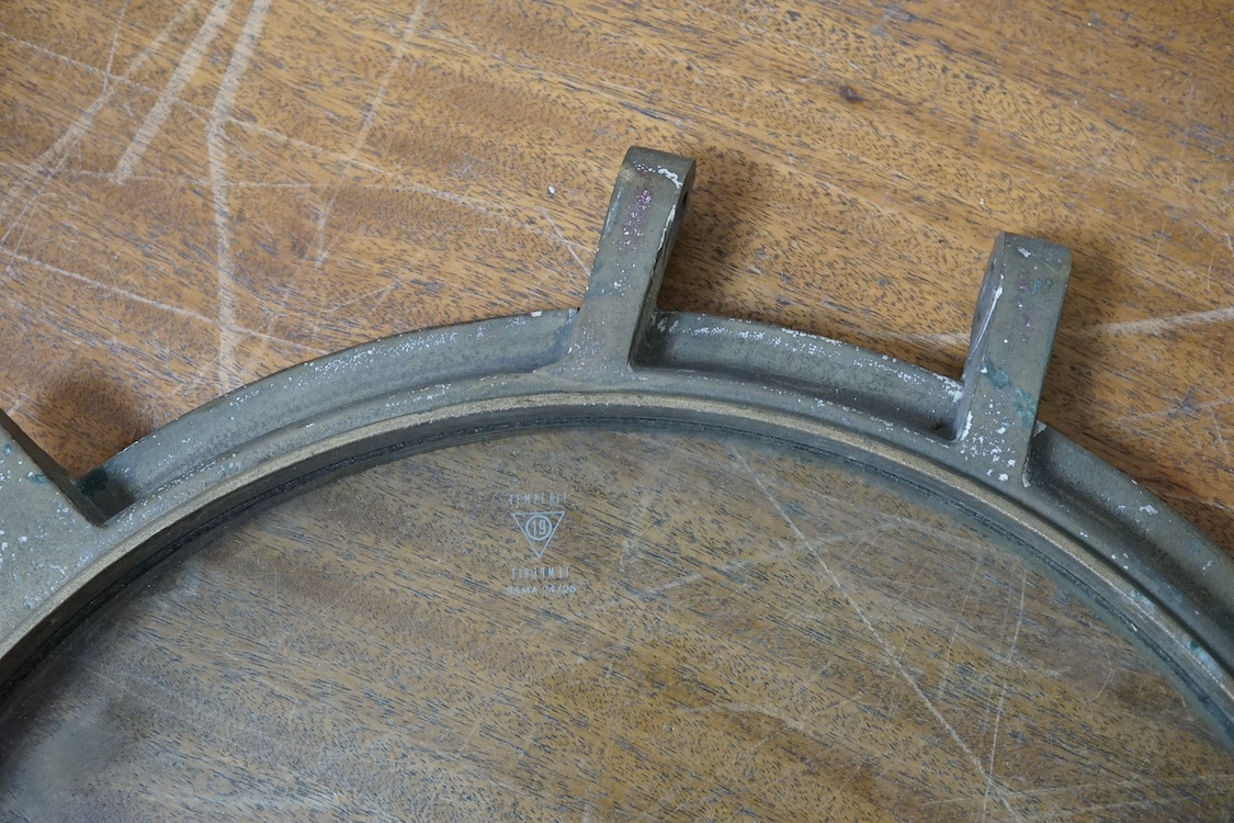 A bronze porthole, possibly submarine use, 54cm in diameter. Condition - fair